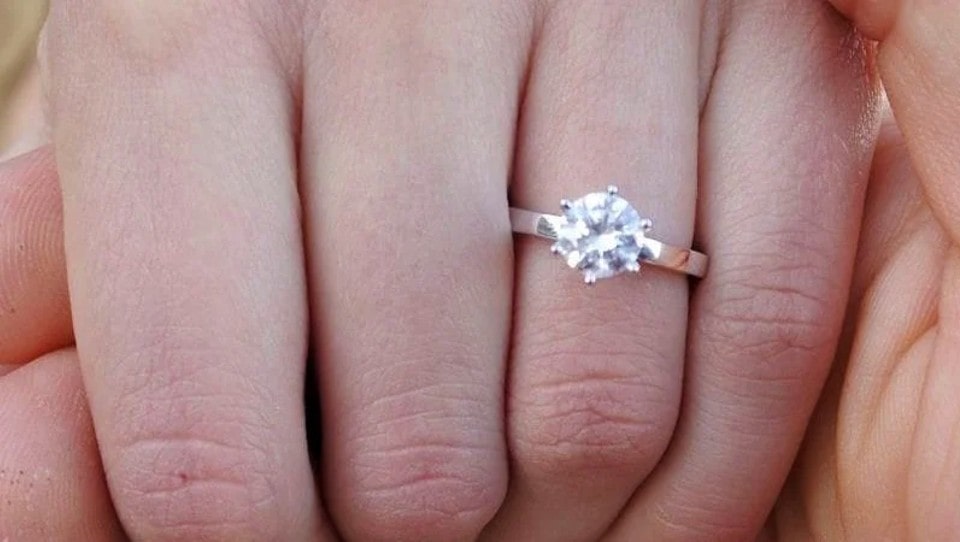 She accepted his diamond ring engagement proposal, and she was in ninth heaven.