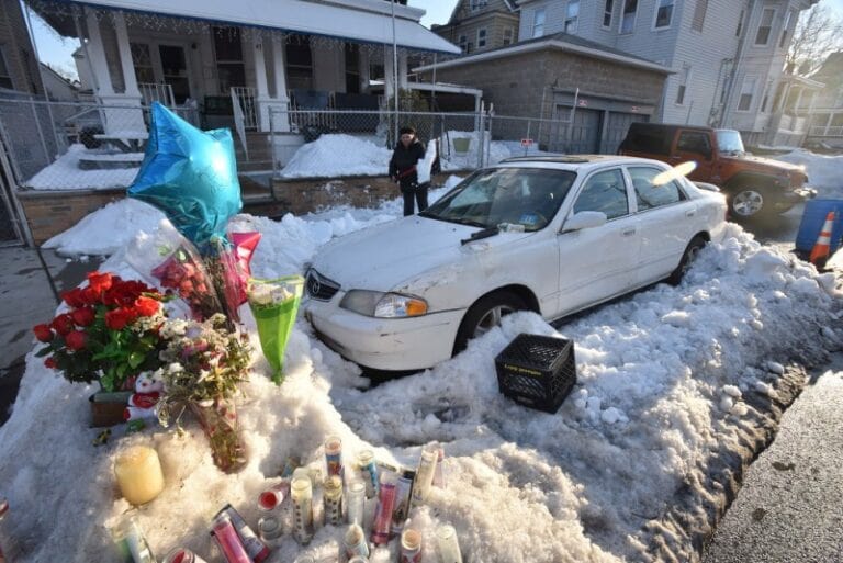 He was in the car with his wife and two kids, but he got out to shovel snow off the front of the car.