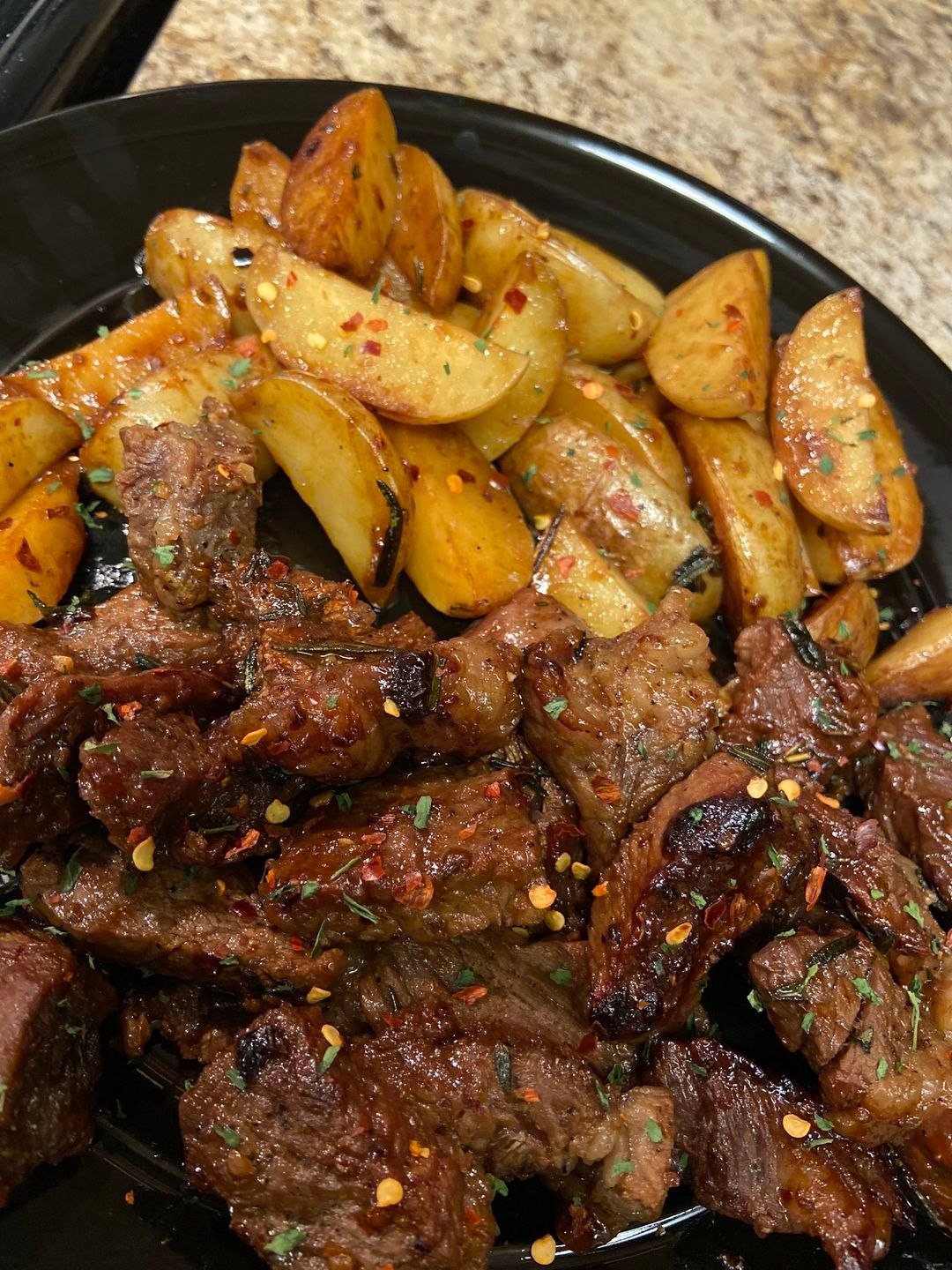 SKILLET WITH GARLIC BUTTER STEAK AND POTATOES