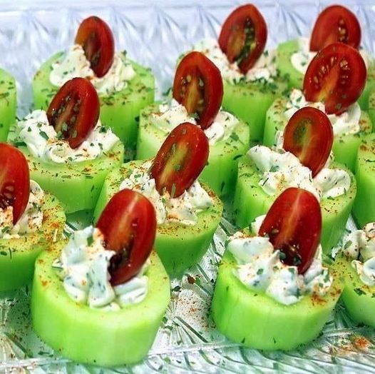 BITES OF CUCUMBER WITH HERBS, CREAM CHEESE, AND CHERRY TOMATO