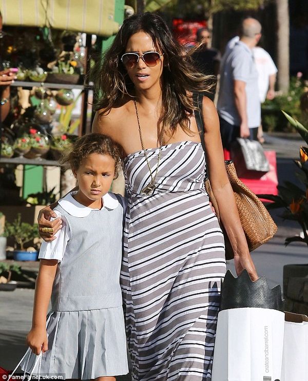 Darker now: Nahla's hair, although pinned back, is brunette. She accompanies her mom Halle Berry in September 2014