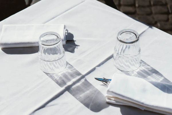 A dining table set with napkins