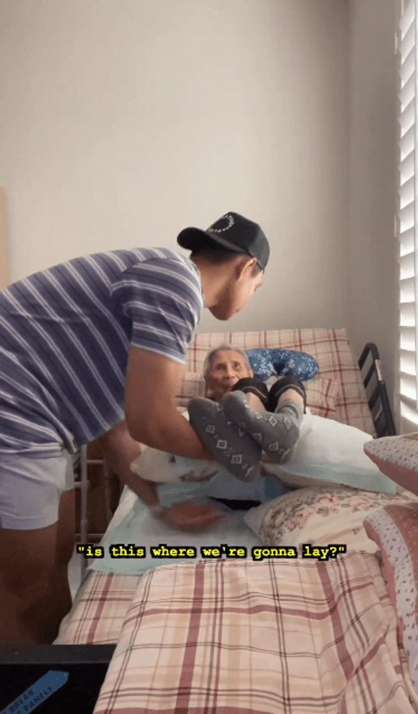 A loving grandson caring for his grandmother