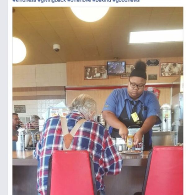 Evoni Williams cutting an elderly man's food