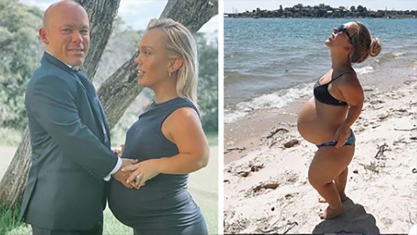 Woman with dwarfism poses proudly with her baby bump on the beach