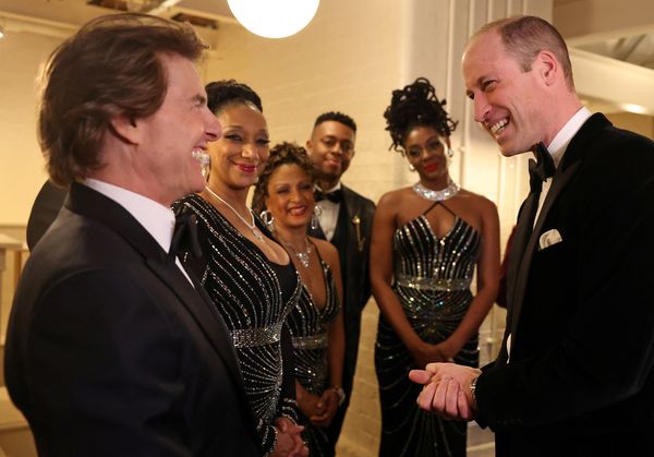Britain's Prince William, Prince of Wales, reacts as he talks with U.S. actor Tom Cruise, at the London Air Ambulance Charity Gala Dinner at The OWO, in central London