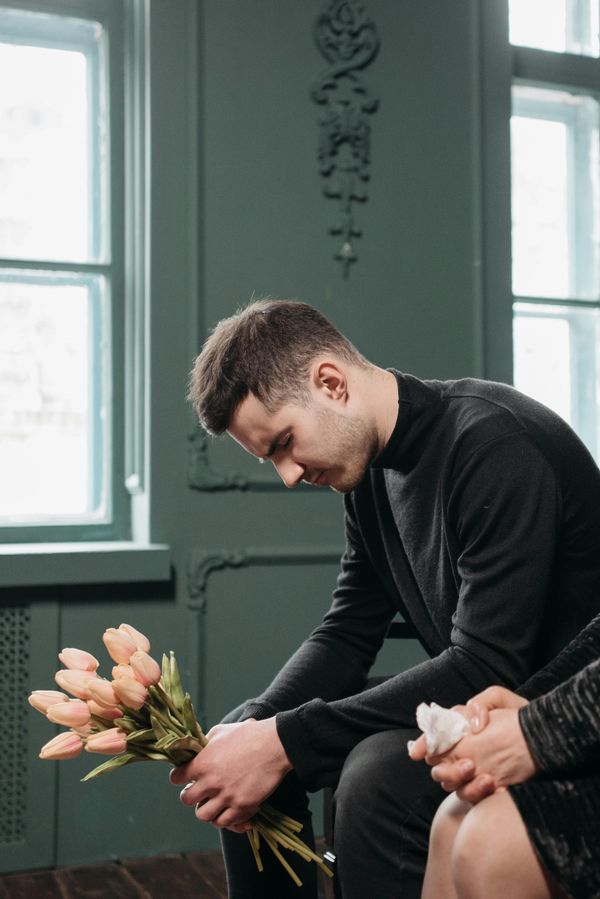 An emotional man at a funeral | Source: Pexels