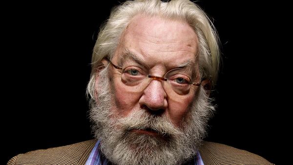 Donald Sutherland with a captivating gaze, sporting a bushy beard and mustache