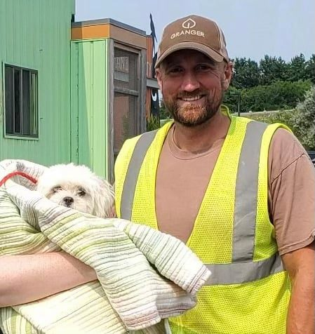 Garbage truck driver finds tiny dog in trash collection, saves her life