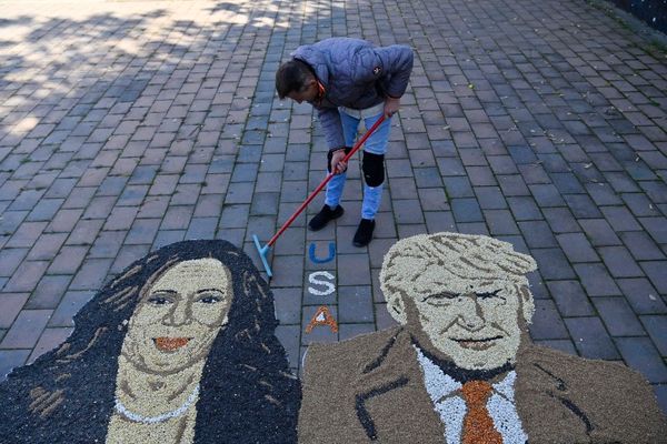 Kosovo artist Alkent Pozhegu creates grain and seed mosaics depicting Kamala Harris and Donald Trump in the town of Gjakova on November 5, 2024.